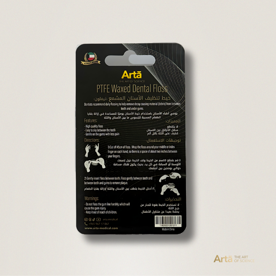 Three containers of PTFE waxed dental floss with the brand 'Artà' displayed on them, placed on a marble surface.