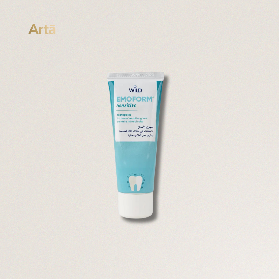 Tube of Wild Emoform Sensitive toothpaste on a light beige background