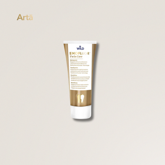 Tube of Wild Emofluor Twin Care on a light beige background