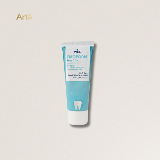 Tube of Wild Emoform Sensitive toothpaste on a light beige background
