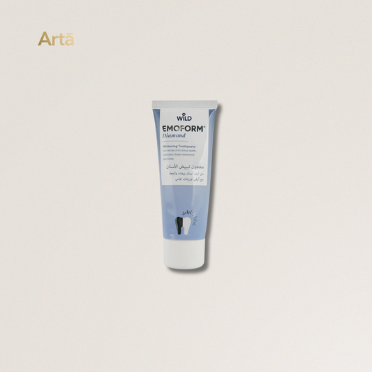 Tube of Wild Emoform Diamond toothpaste on a light gray background