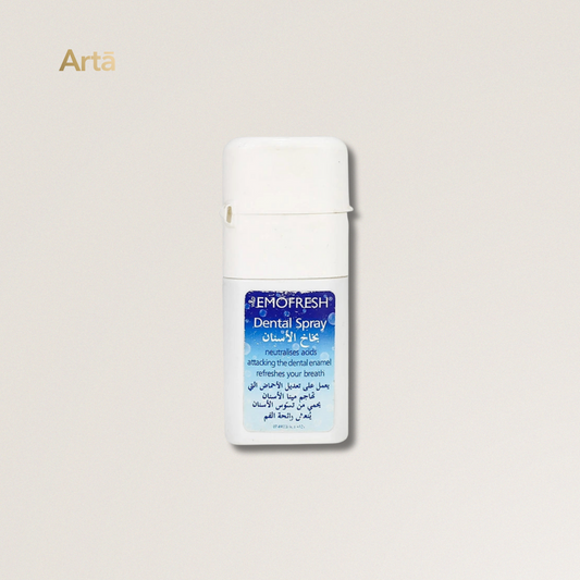 Emofresh dental spray bottle on a light beige background