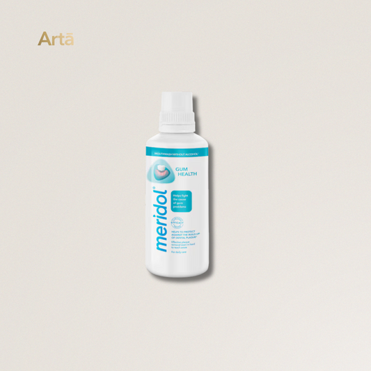 Meridol dental solution bottle on a light gray background